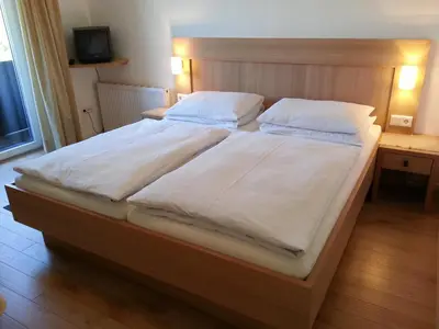Ein Bett oder Betten in einem Zimmer der Unterkunft Rupertihof