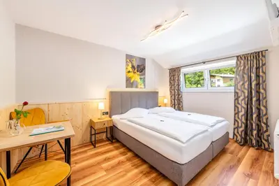 Ein Bett oder Betten in einem Zimmer der Unterkunft Hotel Kollerhof
