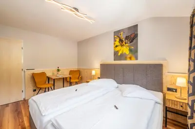 Ein Bett oder Betten in einem Zimmer der Unterkunft Hotel Kollerhof