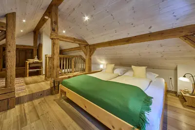 Ein Bett oder Betten in einem Zimmer der Unterkunft Waldharmonie - Chalet & Apartments