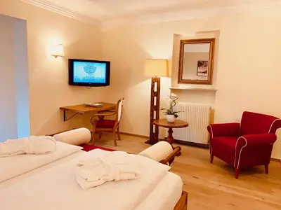 Ein Bett oder Betten in einem Zimmer der Unterkunft Hotel Zum Jungen Römer