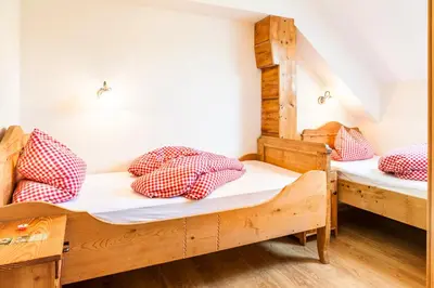 Ein Bett oder Betten in einem Zimmer der Unterkunft Wohlfühlbauernhof Bambichlhof
