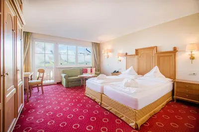 Ein Bett oder Betten in einem Zimmer der Unterkunft Hotel AlpenSchlössl