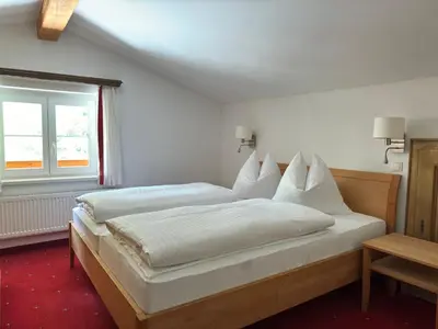 Ein Bett oder Betten in einem Zimmer der Unterkunft Das Anja Alt Filzmoos