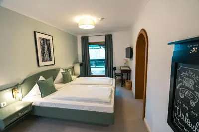 Ein Bett oder Betten in einem Zimmer der Unterkunft Hotel Kogler