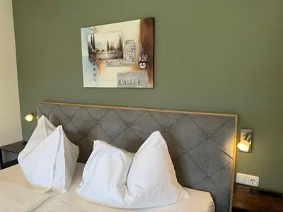 Ein Bett oder Betten in einem Zimmer der Unterkunft Hotel Seerose Wolfgangsee
