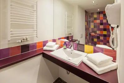 Ein Bett oder Betten in einem Zimmer der Unterkunft Explorer Hotel Hinterstoder