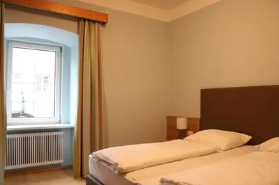 Ein Bett oder Betten in einem Zimmer der Unterkunft Gasthof Goldene Traube