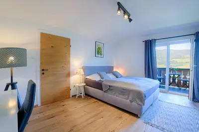 Ein Bett oder Betten in einem Zimmer der Unterkunft Das Talblick - Appartments