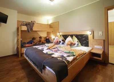 Ein Bett oder Betten in einem Zimmer der Unterkunft Bio-Bauernhof Reiterhof
