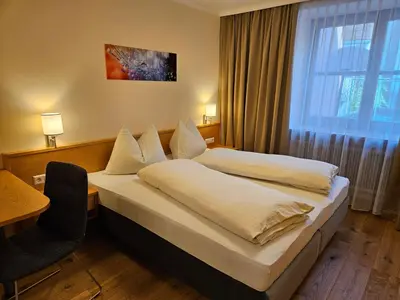 Ein Bett oder Betten in einem Zimmer der Unterkunft Gasthof - Restaurant Löcker