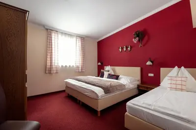 Ein Bett oder Betten in einem Zimmer der Unterkunft Der Jagdhof
