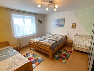 Ein Bett oder Betten in einem Zimmer der Unterkunft Ferienhaus Holiday