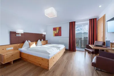 Ein Bett oder Betten in einem Zimmer der Unterkunft Hotel Schönberger