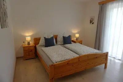 Ein Bett oder Betten in einem Zimmer der Unterkunft Ferienwohnung Hausleitner