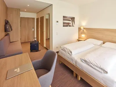 Ein Bett oder Betten in einem Zimmer der Unterkunft Hoftaverne Ziegelböck