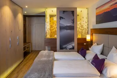 Ein Bett oder Betten in einem Zimmer der Unterkunft Wander- und Wellnesshotel Kanzler