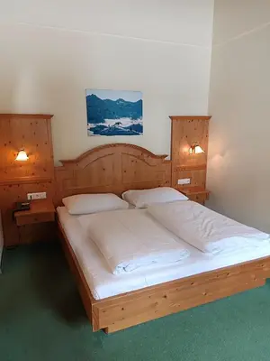 Ein Bett oder Betten in einem Zimmer der Unterkunft Hotel Grünwaldkopf