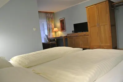 Ein Bett oder Betten in einem Zimmer der Unterkunft Kirchenwirt Gosau