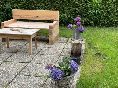 Ein Garten an der Unterkunft Alpen Apartement