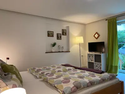 Ein Bett oder Betten in einem Zimmer der Unterkunft Alpen Apartement