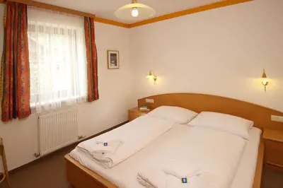 Ein Bett oder Betten in einem Zimmer der Unterkunft Gästehaus Brigitte