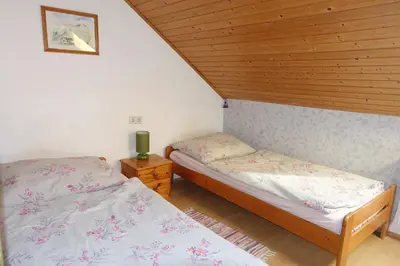 Ein Bett oder Betten in einem Zimmer der Unterkunft Leitingerhof