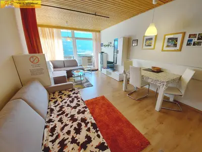Ein Sitzbereich in der Unterkunft Apartment Grimmingblick