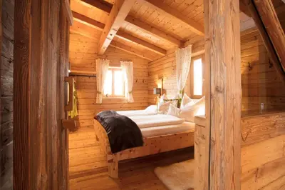 Ein Bett oder Betten in einem Zimmer der Unterkunft Chalet Lärchenzipf