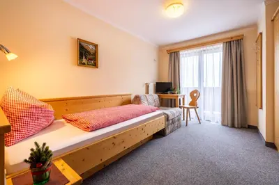 Ein Bett oder Betten in einem Zimmer der Unterkunft Gasthof Kogelalm