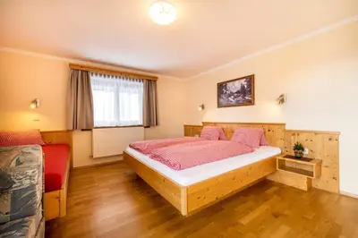 Ein Bett oder Betten in einem Zimmer der Unterkunft Gasthof Kogelalm