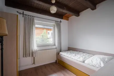 Ein Bett oder Betten in einem Zimmer der Unterkunft Rekreacni dum Grimming