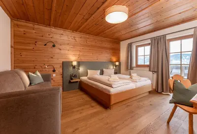 Ein Bett oder Betten in einem Zimmer der Unterkunft Almwelt Austria
