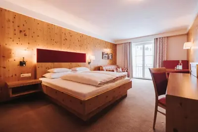Ein Bett oder Betten in einem Zimmer der Unterkunft Superior Hotel Schneider Ski-in & Ski-out