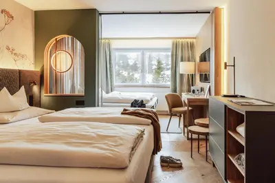 Ein Bett oder Betten in einem Zimmer der Unterkunft Hotel Römerhof Superior