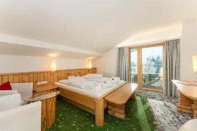 Ein Bett oder Betten in einem Zimmer der Unterkunft Hartweger's Hotel