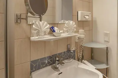 Ein Badezimmer in der Unterkunft Hartweger's Hotel