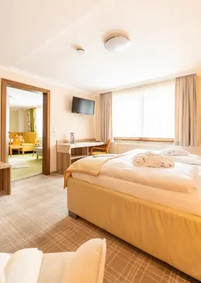 Ein Bett oder Betten in einem Zimmer der Unterkunft Chalet Ferienhaus Hubertus