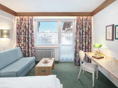 Ein Bett oder Betten in einem Zimmer der Unterkunft Genuss - und Vitalhotel Moisl