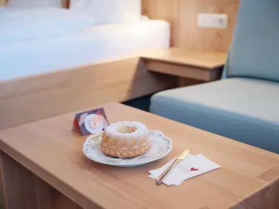 Ein Bett oder Betten in einem Zimmer der Unterkunft Genuss - und Vitalhotel Moisl