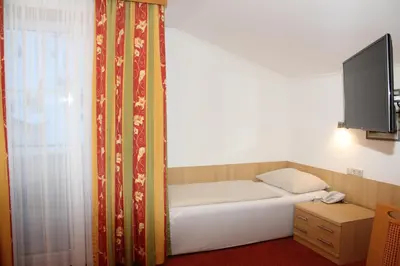 Ein Bett oder Betten in einem Zimmer der Unterkunft Der Sailer Hotel & Restaurant