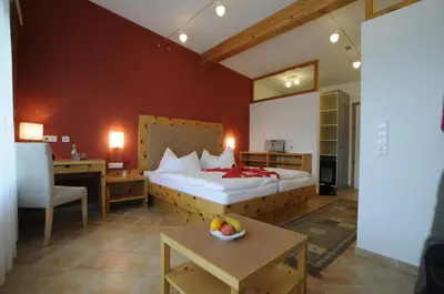 Ein Bett oder Betten in einem Zimmer der Unterkunft MAYER - Wirtshaus und Dorfhotel