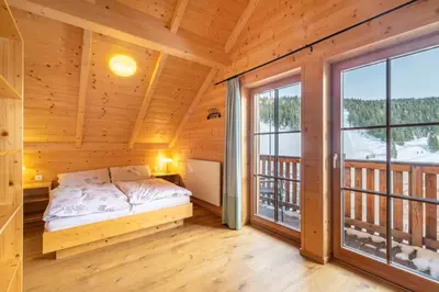 Ein Bett oder Betten in einem Zimmer der Unterkunft Veselý Svišť Chalet Lachtal