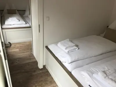 Ein Bett oder Betten in einem Zimmer der Unterkunft Pension Kirchenwirt