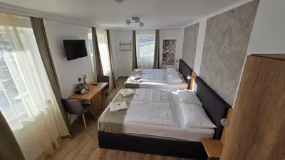 Ein Bett oder Betten in einem Zimmer der Unterkunft Gasthof Kreischberg