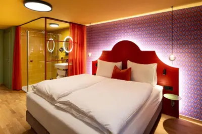 Ein Bett oder Betten in einem Zimmer der Unterkunft Schwarzes Rössl