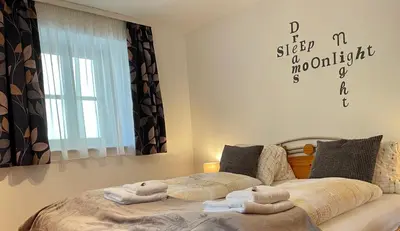 Ein Bett oder Betten in einem Zimmer der Unterkunft Apartment Krämerhaus Annaberg, Dachstein West