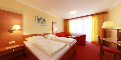 Ein Bett oder Betten in einem Zimmer der Unterkunft Hotel Lohninger-Schober 3 Stern Superior