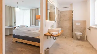 Ein Bett oder Betten in einem Zimmer der Unterkunft Grimming Lodge by keyone