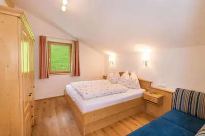 Ein Bett oder Betten in einem Zimmer der Unterkunft Hinterfischbachhof